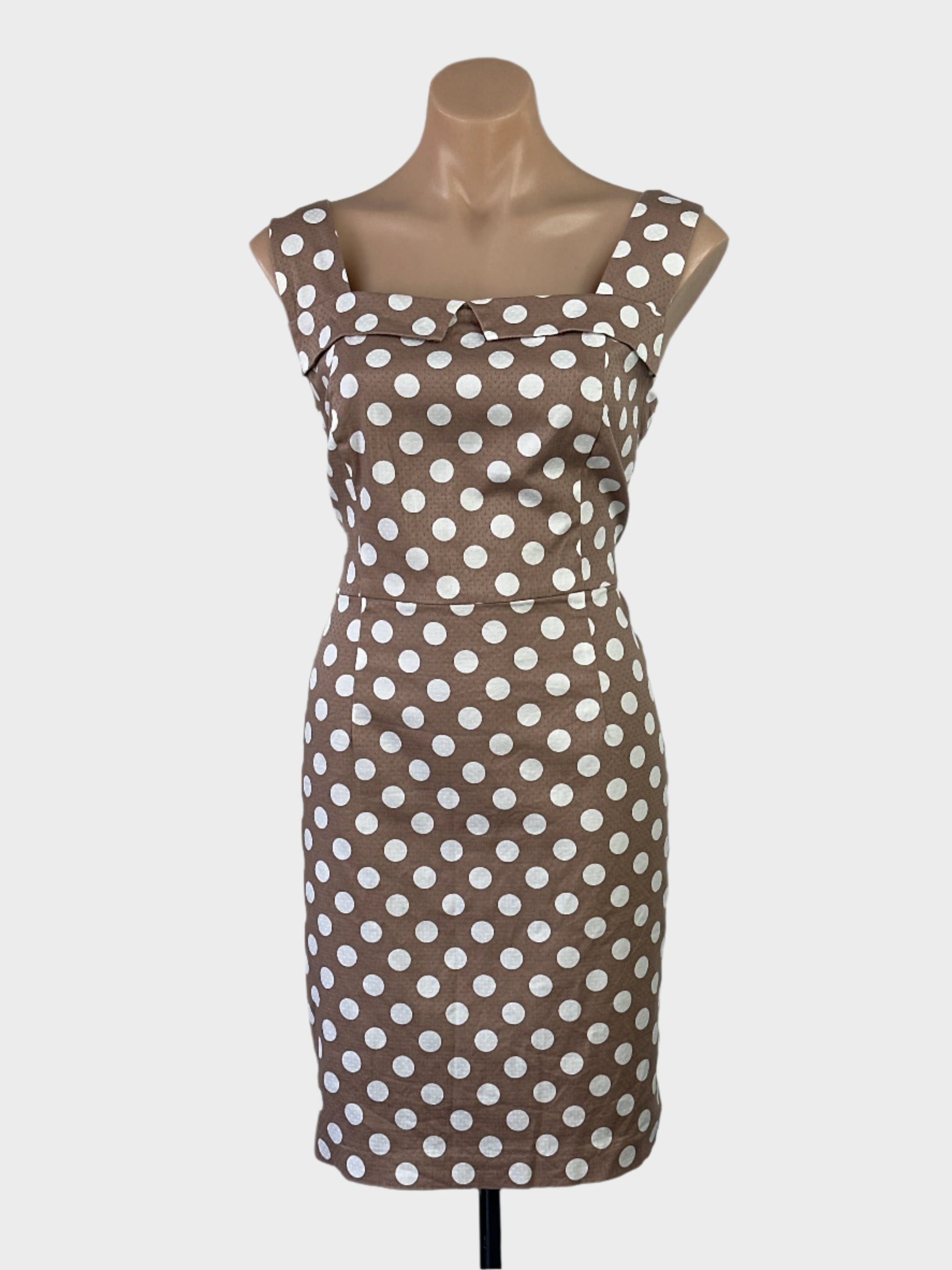 Review brown and white retro 60's sleeveless sheath dress with polka dot print, notched collar and pencil skirt for office or smart casual wear.