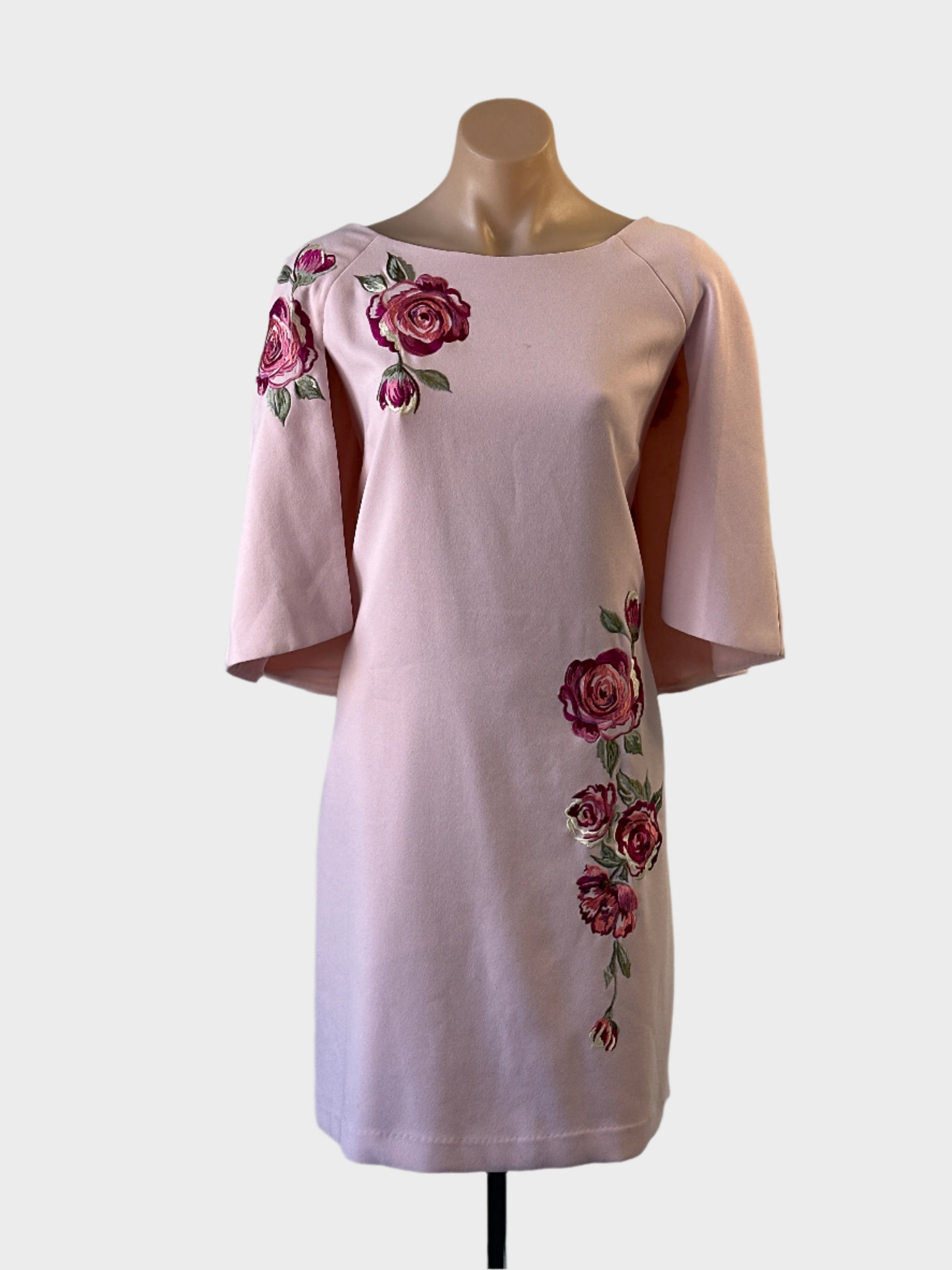Review shift dress in pink crepe with floral embroidery and cape back for special events wear.