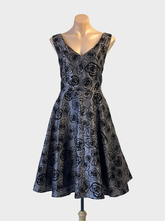 Revival A-line dress in silver and black with floral appliqué and tulle petticoat for evening wear.