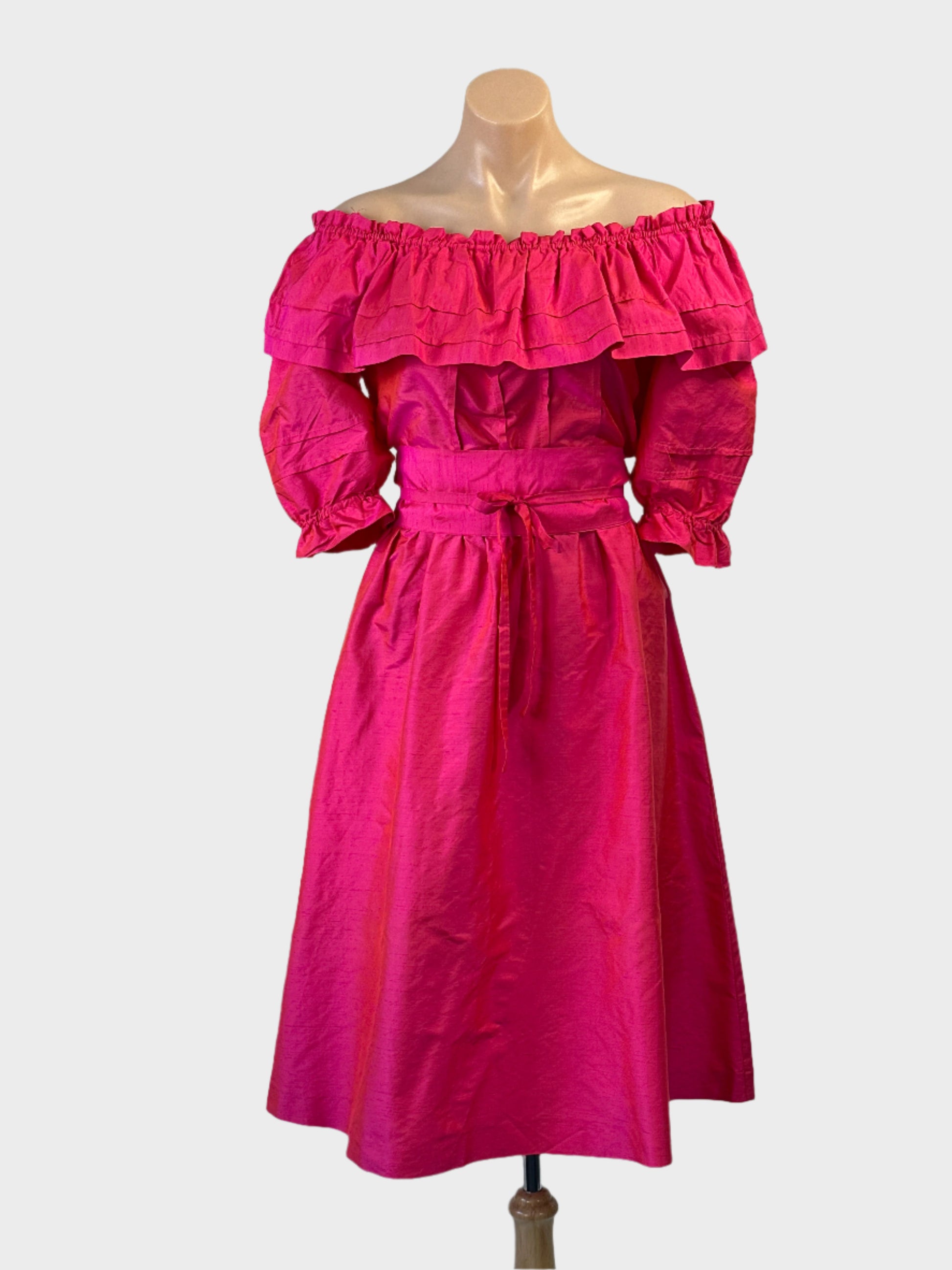 Rodney Clark off the shoulder dress in pink with ruffle neckline and full skirt for formal or special events wear.