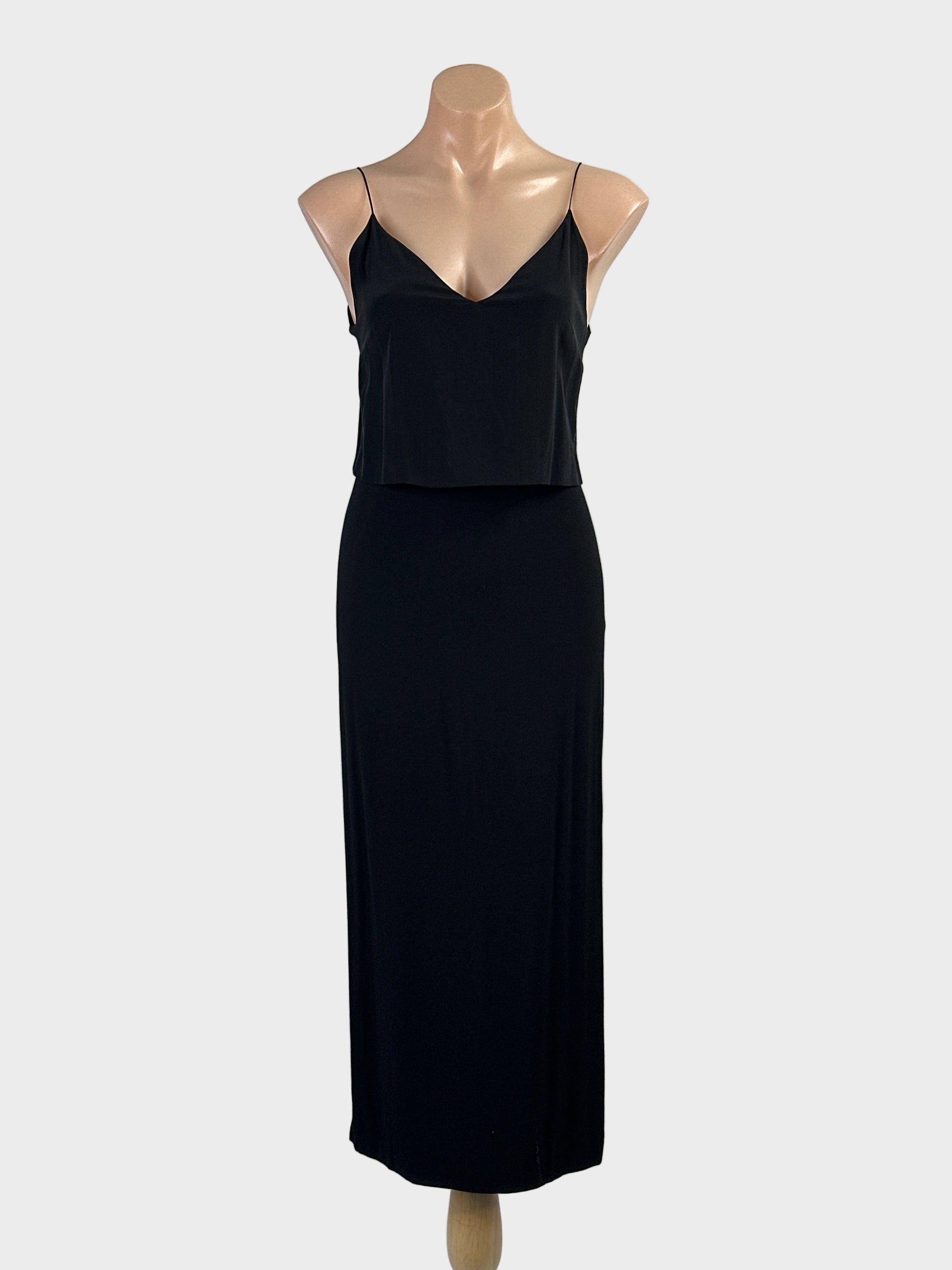 Designer Sandro black sleeveless maxi gown with overlay top, v-neck and straight skirt with side slits for formal or evening wear.