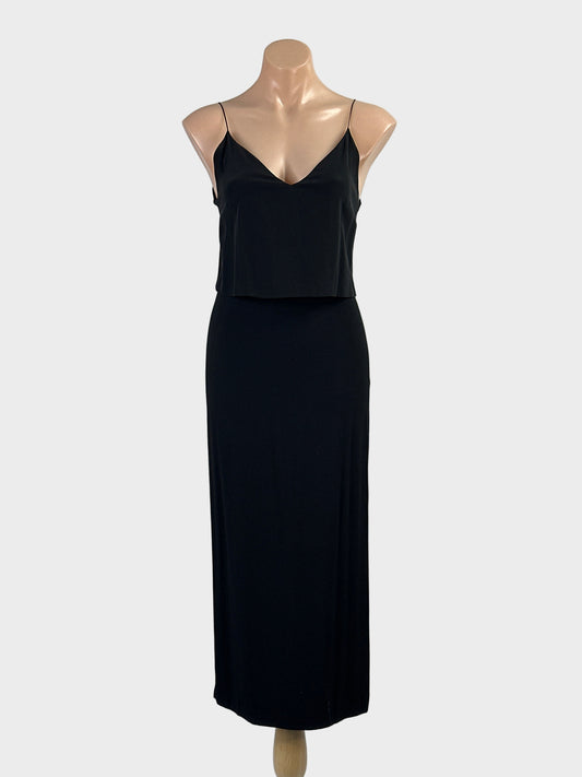Designer Sandro black sleeveless maxi gown with overlay top, v-neck and straight skirt with side slits for formal or evening wear.