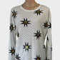 Designer Sass & Bide white ribbed knit top with black and gold sequin star motif, round neck and long sleeves for smart casual or evening wear.