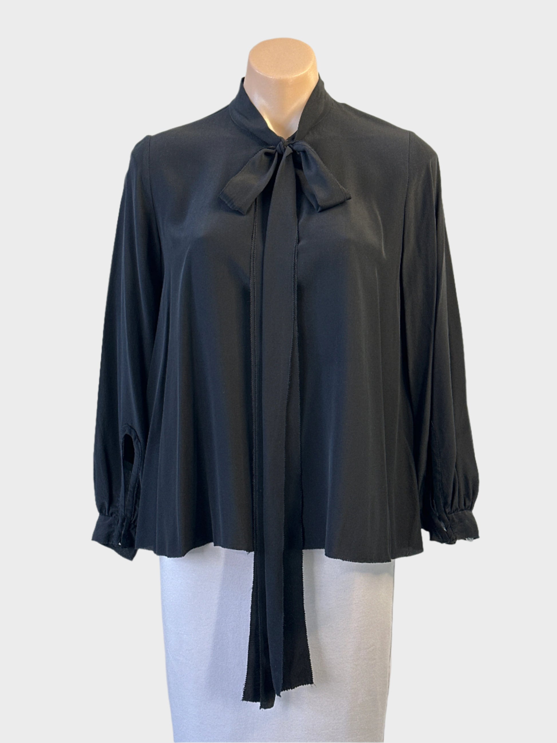 Designer Scanlan Theodore top in black silk with pussy bow and overlock trim for office or evening wear.