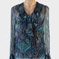 Designer See by Chloé poets shirt in blue sheer silk with floral print, v-neck with ruffle collar and long sleeves for evening or special events.