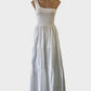 Seed one shoulder maxi dress in white with shirred bodice, asymmetric neck and tiered skirt for smart casual or resort wear.