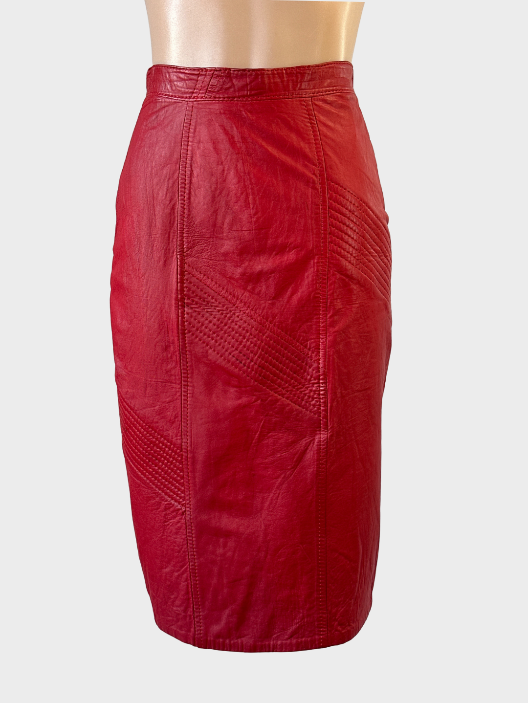 Simkka Furs vintage 80s lipstick red leather skirt with striped topstitching and back vent for business or smart casual wear.