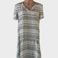 Designer SKIN & THREADS drop waist dress in grey pure silk with contrasting striped prints, v-neck and pleated skirt for smart casual and resort wear.