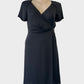 Sportscraft black silk A-line dress with surplice neck, wrap front panel, raglan sleeves and layered skirt for evening wear.