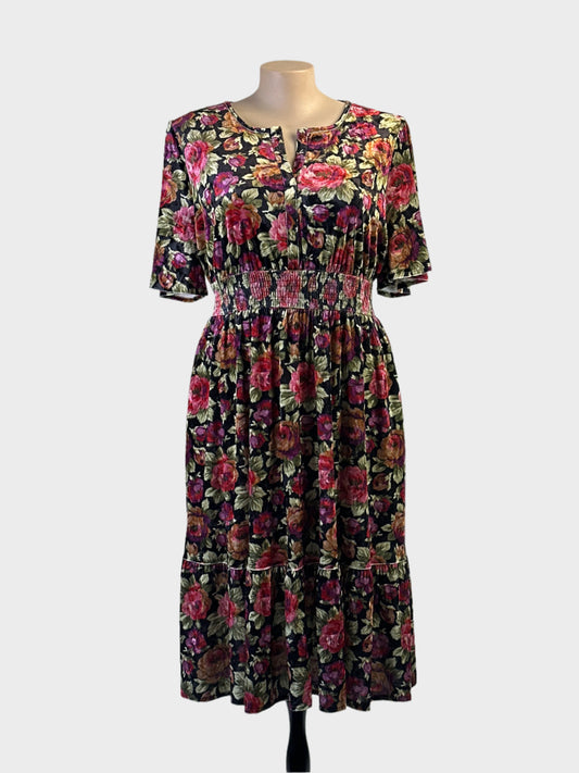 Taking Shape blouson dress in velvet floral print with shirred waist, puff sleeves and flounce hem for evening or special events.