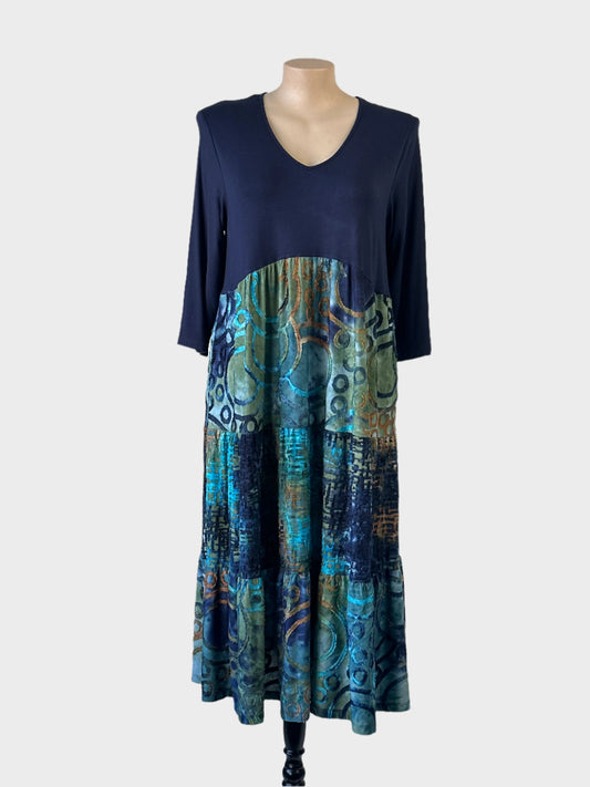 Taking Shape dress in midnight blue with v-neck, three quarter sleeves and contrasting tiered skirt embellished with flocked appliqué for smart casual or office wear.