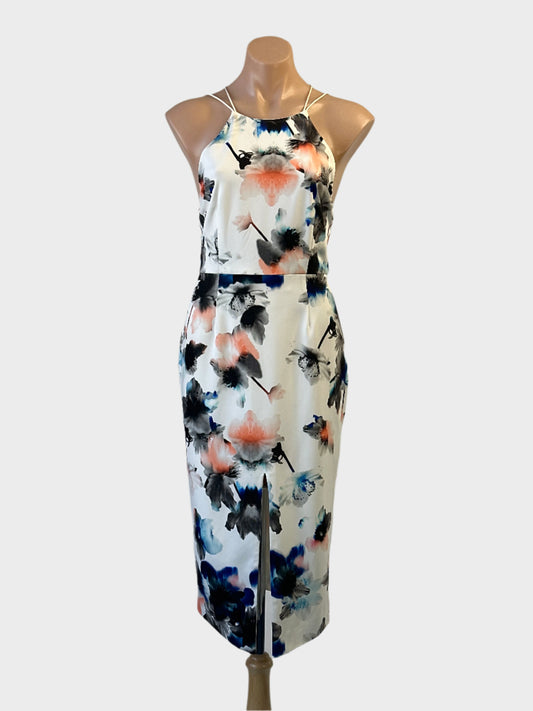 Talulah sheath dress in ivory and orange floral print with halter neck and front slit for formal or special events wear.