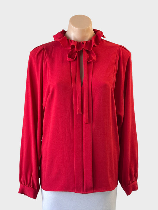 Designer Tara Jarmon top in red crepe with pleated front and bow tie neck for special events or office wear.