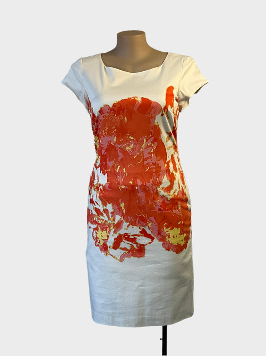 Designer Trent Nathan shift dress in white and orange abstract print with cap sleeves for office or special events wear.