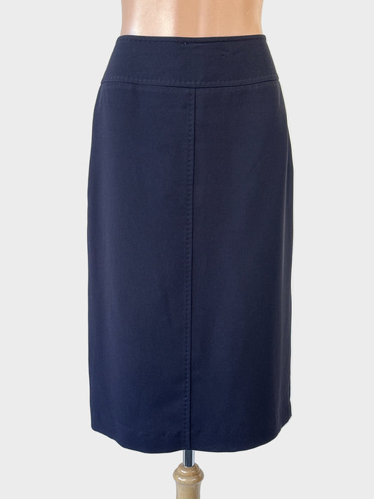 Trent Nathan navy straight skirt with yoke waist, topstitched seams and back vent for office wear.