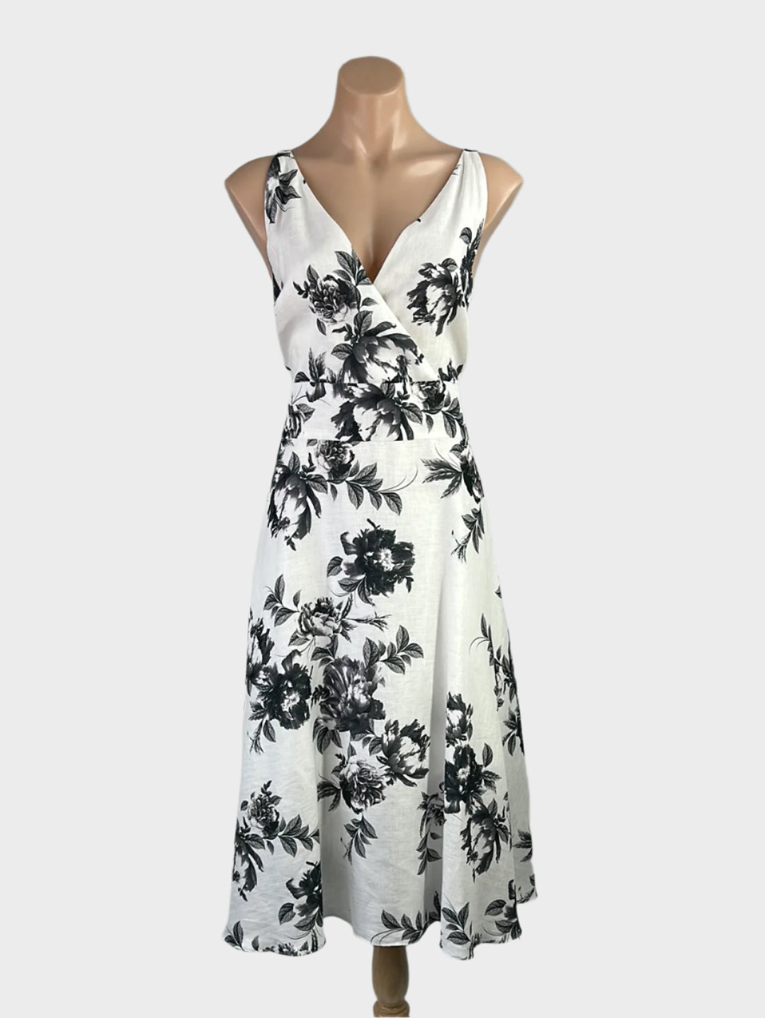 Veronika Maine black and white A-line dress in linen with floral print, surplice neck, and full skirt for smart casual or office wear.