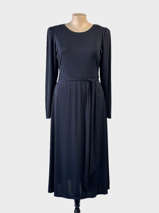 Veronika Maine black jersey A-line maxi dress with waist sash for office or smart casual wear.