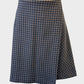 Veronika Maine flared skirt in black and brown check weave with side pleat for office wear.