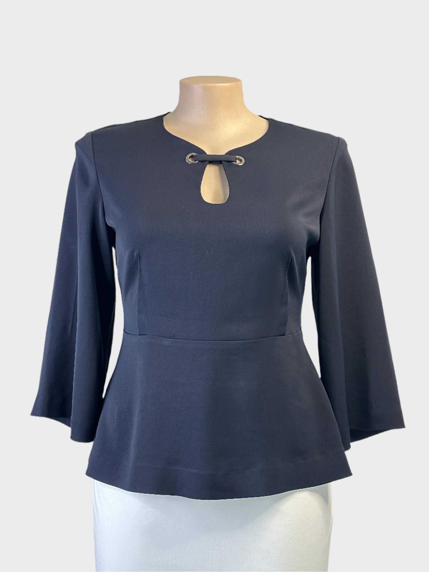 Veronika Maine navy peplum top with keyhole neck and centre back pleat for office or evening wear.