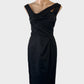 Veronika Maine sheath dress in black satin finish with asymmetric pleated neck and pleated pencil skirt for formal wear.