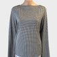 Veronika Maine jersey top in cream and black houndstooth with notched cuffs for office wear.