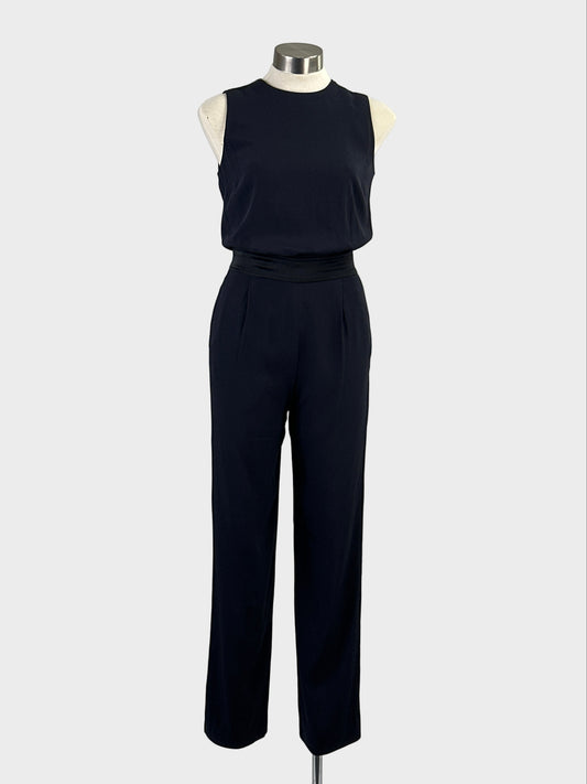 Designer Victoria Beckham navy sleeveless pantsuit with blouson bodice, open back and pleated straight legs for evening or special events.
