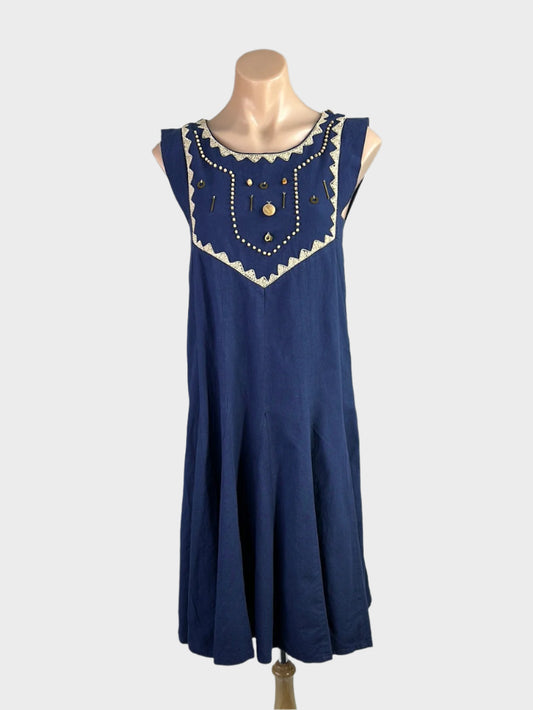 Vintage designer Prue Acton navy blue vintage 70's trapeze dress in cotton with embroidered bib and godet skirt for smart casual or special events.