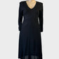 Vintage Von Troska dress in black jersey with paneled bodice and v-neck for evening wear.