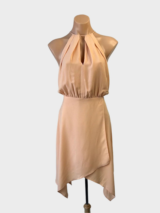 Wish retro 70's style halter neck dress in light orange crepe with keyhole neck and handkerchief skirt for smart casual wear.