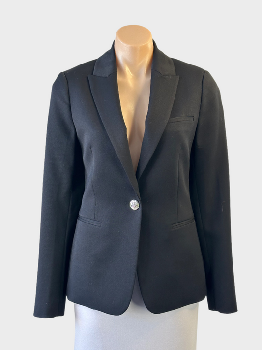Witchery black jacket with notched lapels and jetted pockets for office wear.