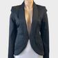 Designer Zac Posen jacket in black with curved hem and topstitching for evening wear.