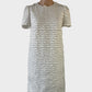 Designer Zimmermann shift dress in white sheer weave with appliqué lace, round neck and short sleeves for special events.