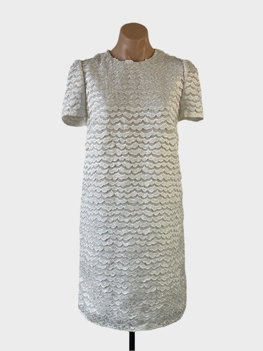 Designer Zimmermann shift dress in white sheer weave with appliqué lace, round neck and short sleeves for special events.